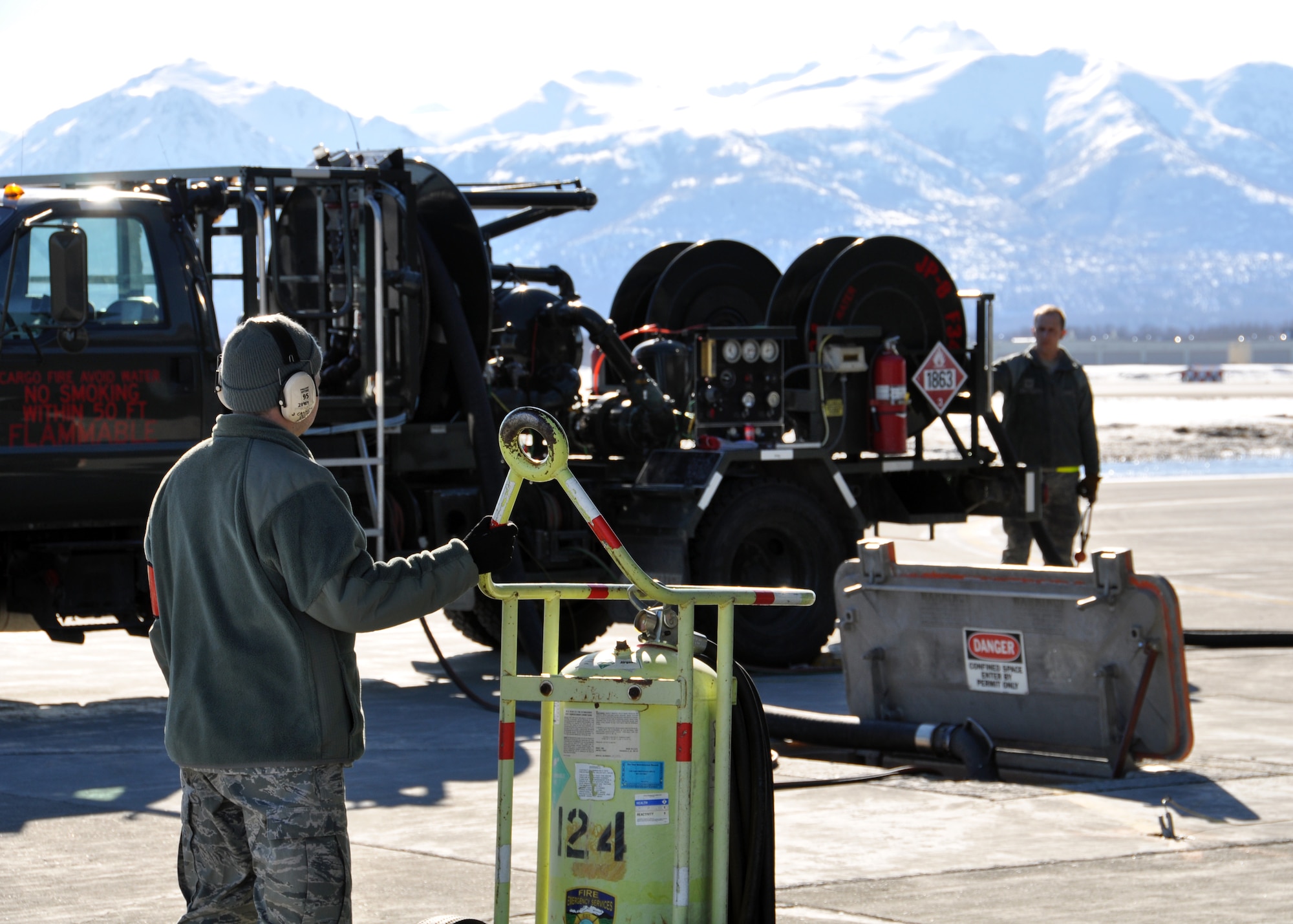 A Citizen Airman from the 446th Aircraft Maintenance Squadron out of McChord Field, Wash., monitors aircraft fuel flow, April 25 at Joint Base Elmendorf-Richardson, Alaska. Reservists from the 446th AMXS were at JBER fulfilling their two-week annual training requirements with the 732nd Air Mobility Squadron, JBER, April 21 to May 5. (U.S. Air Force photo/Tech. Sgt. Dana Rosso) 