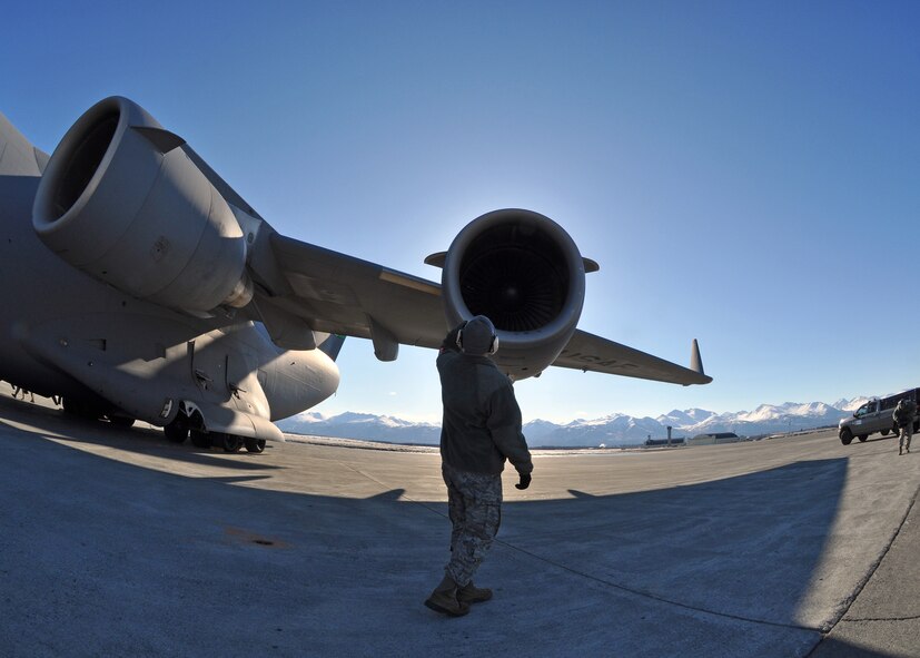 A Citizen Airman from the 446th Aircraft Maintenance Squadron out of McChord Field, Wash., performs a prefight walk-around inspection on a McChord C-17 Globemaster III aircraft, April 25 at Joint Base Elmendorf-Richardson, Alaska. Reservists from the 446th AMXS were at JBER fulfilling their two-week annual training requirements with the 732nd Air Mobility Squadron, JBER, April 21 to May 5. (U.S. Air Force photo/Tech. Sgt. Dana Rosso)
