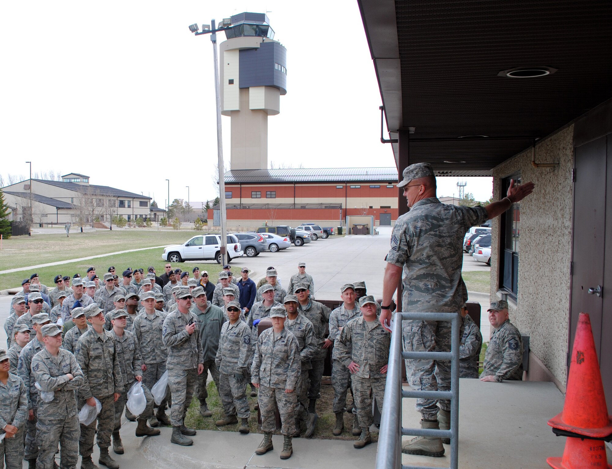 Chief Master Sgt. Christopher Crafton, 319th Civil Engineer Squadron superintendent, delivers a safety briefing before a FOD (foreign object or debris) walk held May 10, 2013, on the flightline at Grand Forks Air Force Base, N.D.  A FOD walk is a safety inspection conducted on flightlines and flight decks to remove foreign objects or debris. (U.S. Air Force photo/Staff Sgt. Luis Loza Gutierrez)
