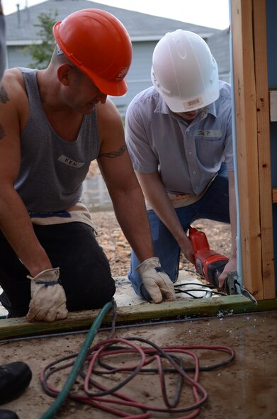 Members of Air Force Recruiting Service volunteered their Saturday to assist Habitat for Humanity build a home in San Antonio, Texas May 11. The house is scheduled for completion in August. Habitat for Humanity seeks volunteers to help build and landscape affordable homes for qualified low-income families. (U.S. Air Force photo/Staff Sgt. Hillary Stonemetz)