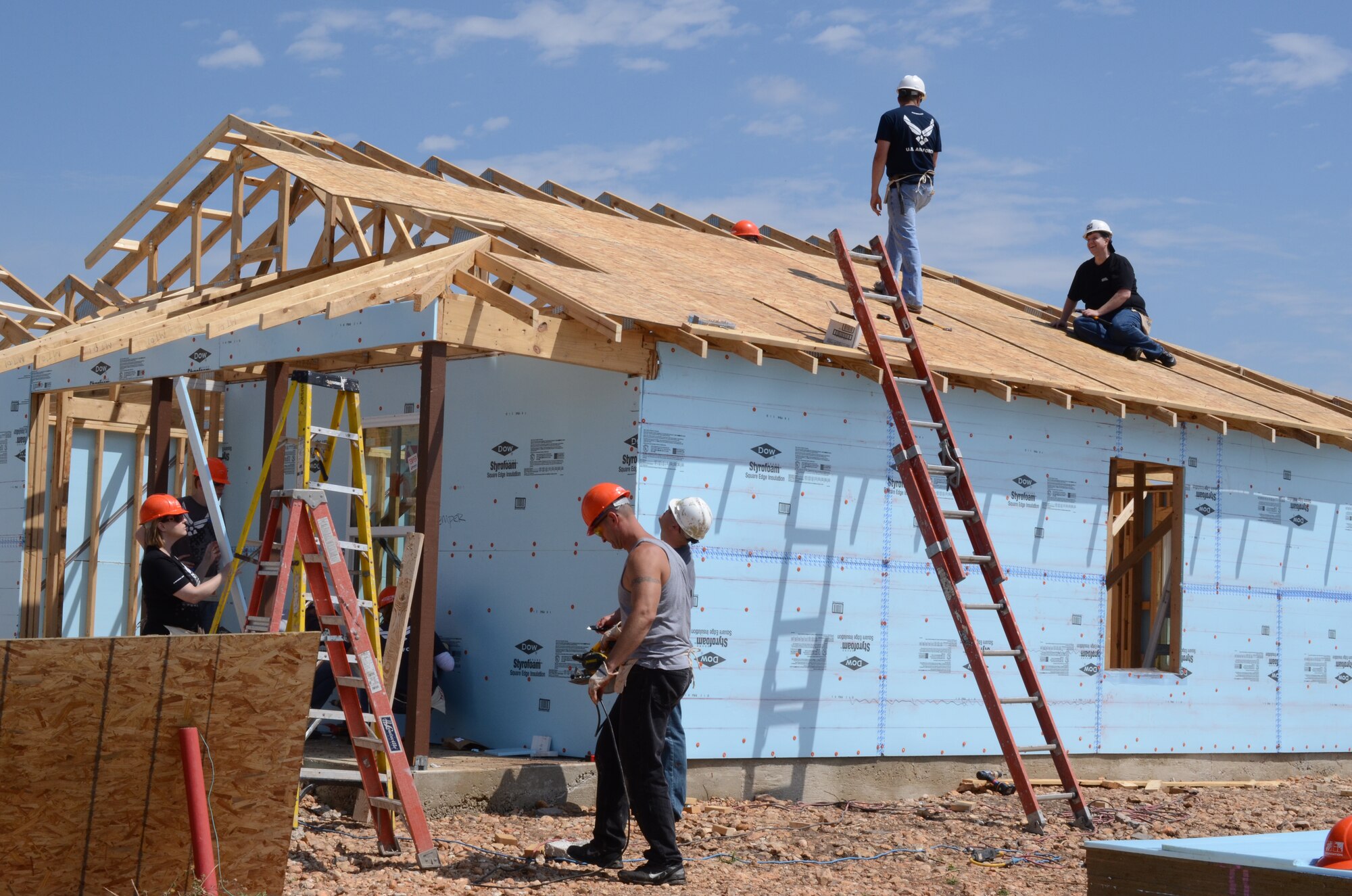 Several members of Air Force Recruiting Service volunteered their Saturday to assist Habitat for Humanity build a home in San Antonio, Texas May 11. The house is scheduled for completion in August. Habitat for Humanity seeks volunteers to help build and landscape affordable homes for qualified low-income families. (U.S. Air Force photo/Staff Sgt. Hillary Stonemetz)