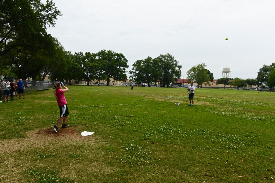A participant in the homerun derby hits a ball during the 2013 Sports Day on Barksdale Air Force Base, La., May 10, 2013. Sports Day was designed to improve teamwork and help increase the awareness of fitness, sports programs and boost morale. (U.S. Air Force photo/Senior Airman Micaiah Anthony)