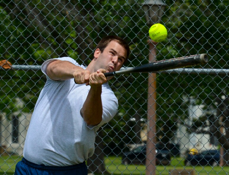 A participant in the homerun derby hits a ball during the 2013 Sports Day on Barksdale Air Force Base, La., May 10, 2013. Sports Day is an annual event that gives Airmen the opportunity to participate in several individual and team sports throughout the day. (U.S. Air Force photo/Senior Airman Micaiah Anthony)