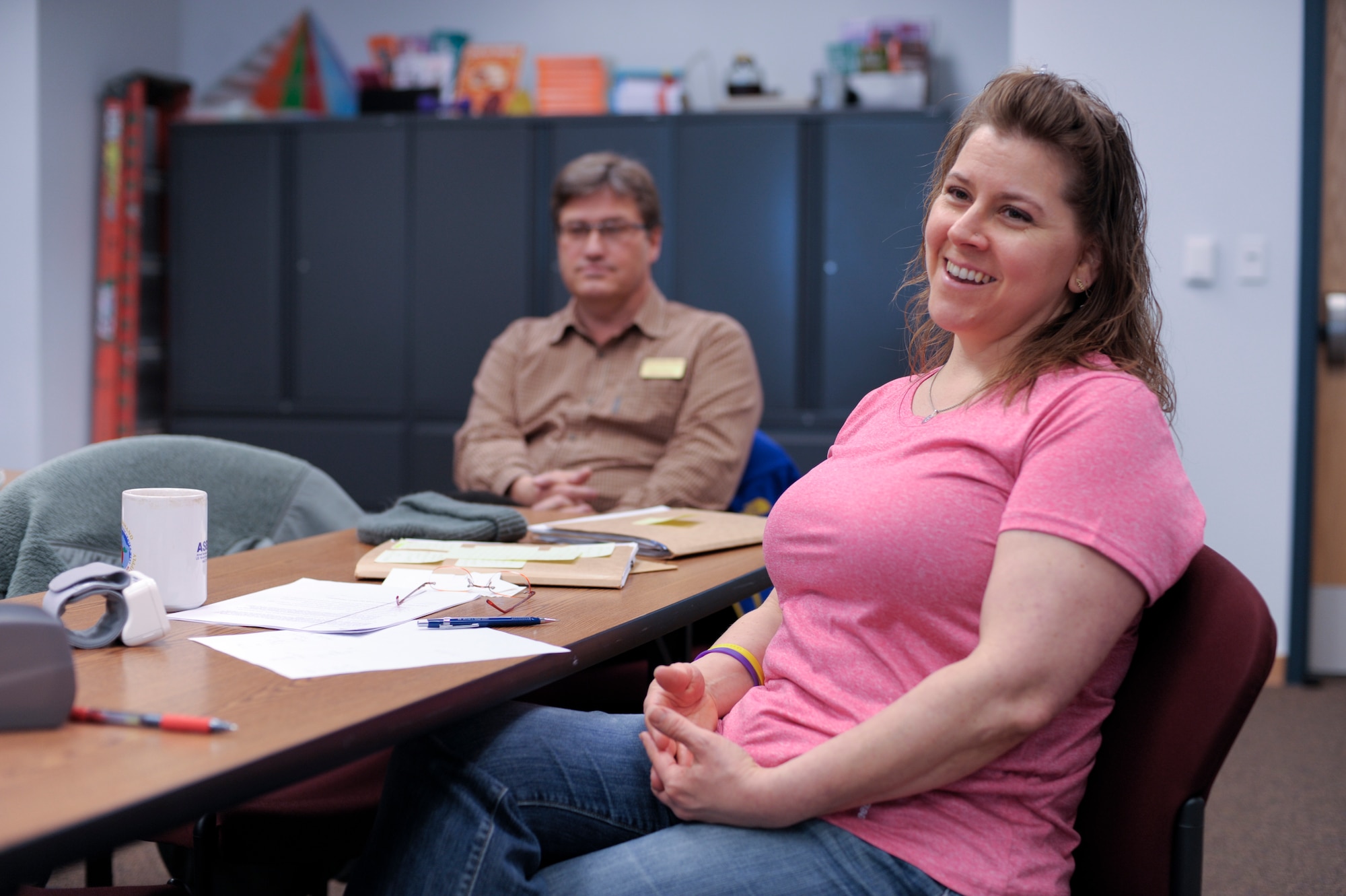 Janneane Moody, 354th Medical Operations Squadron health promotion program manager, and Mike Bowers, 354th MDOS military and family life counselor, welcome newcomers to a Tobacco Cessation class in the Baker Field House May 8, 2013, Eielson Air Force Base, Alaska. The Health and Wellness Center hosts the program to help Eielson Icemen and family members quit their usage of tobacco products. (U.S. Air Force Photo by Airman 1st Class Peter Reft/Released)