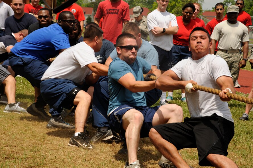 Airmen from the 2nd Civil Engineer Squadron play tug-of-war during Sports Day on Barksdale Air Force Base, La., May 10, 2013. Sports Day consisted of various team events including dodgeball, basketball, soccer, tug-of-war, volleyball, a homerun derby and racquetball. This day was designed to improve teamwork and help increase the awareness of fitness, sports programs and boost morale. (U.S. Air Force photo/Airman 1st Class Andrew Moua)
