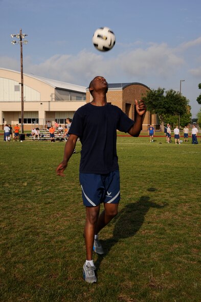 Airman 1st Class Kevin Yator, 2nd Civil Engineer Squadron, practices before a soccer game during Sports Day on Barksdale Air Force Base, La., May 10, 2013. Sports Day consisted of various team events including dodgeball, basketball, soccer, tug-of-war, volleyball, a homerun derby and racquetball. This day was designed to improve team-work and help increase the awareness of fitness, sports programs and boost morale. (U.S. Air Force photo/Airman 1st Class Andrew Moua)