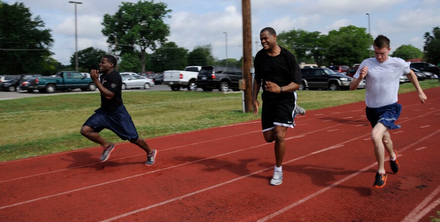 Barksdale Airmen participate in a 50-meter dash during Sports Day on Barksdale Air Force Base, La., May 10, 2013. Sports Day consisted of various team events including dodgeball, basketball, soccer, tug-of-war, volleyball, a homerun derby and racquetball. This day was designed to improve teamwork and help increase the awareness of fitness, sports programs and boost morale. (U.S. Air Force photo/Airman 1st Class Andrew Moua)