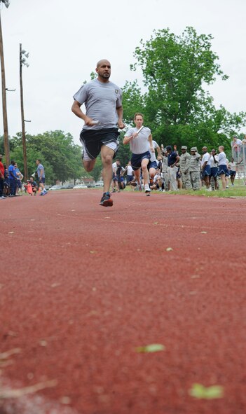 Barksdale Airmen participate in the 1.5 mile relay during Sports Day on Barksdale Air Force Base, La., May 10, 2013. Sports Day is an annual event that gives Airmen the opportunity to participate in several individual and team sports to boost morale and camaraderie. (U.S. Air Force photo/Airman 1st Class Andrew Moua)