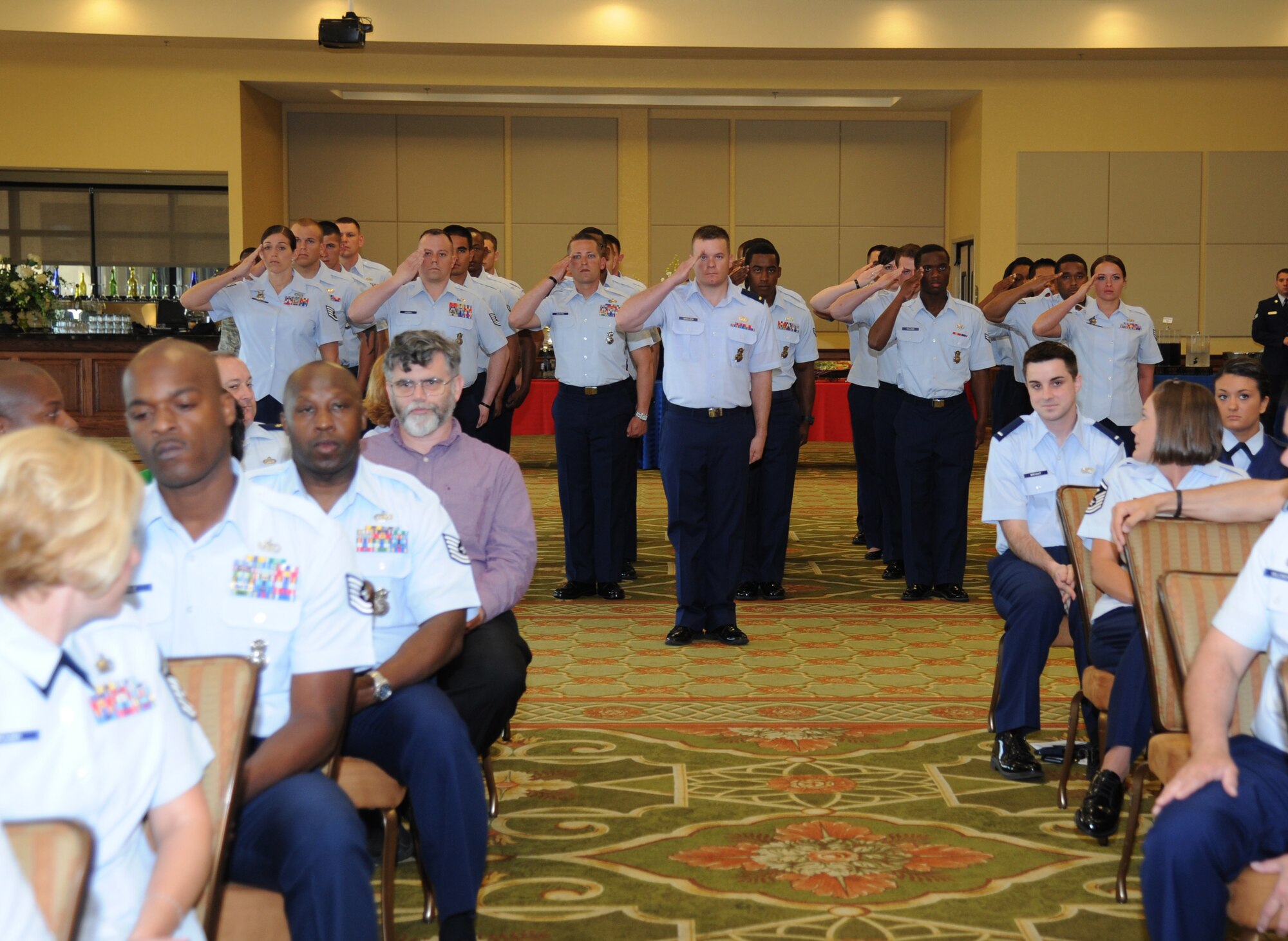 Members of the 81st Security Forces Squadron render a first salute to Maj. Brian Fitzpatrick, incoming 81st SFS commander,  during the 81st SFS change of command ceremony May 13, 2013, at the Bay Breeze Event Center, Keesler Air Force Base, Miss.  Maj. Matthew Pignataro, outgoing 81st SFS commander, relinquished his command to Fitzpatrick and Col. Mark Vivians, 81st Mission Support Group commander, served as the presiding officer for the event.  (U.S. Air Force photo by Kemberly Groue)