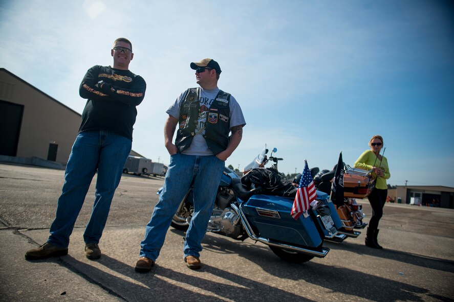 U.S. Air Force Tech. Sgts. Jason Pines (left) and Paul Hendley, both from the 23d Logistics Readiness Squadron, share laughs before the start of the base’s first-ever Air Force Assistance Fund Motorcycle Ride Fundraiser May 10, 2013, at Moody Air Force Base, Ga. Moody hopes to make the motorcycle ride an annual event. (U.S. Air Force photo by Staff Sgt. Jamal D. Sutter/Released) 