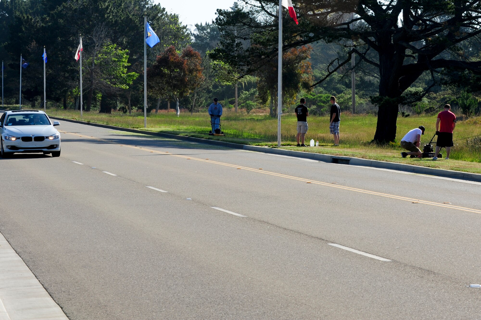 VANDENBERG AIR FORCE BASE, Calif. – Active duty and civilian volunteer’s cut grass during Mission Support Group Pride Day here Friday, May 10, 2013. The MSG Pride Day consisted of more than 80 volunteers with lawnmowers, weed eaters, gloves and trash bags to restore the bases appearance due to budgetary cuts. “The volunteers that have mowed already, and the ones working tomorrow, are restoring the bases appearance that we all expect. After all, our base appearance is a reflection of us as an organization and team,” said Chief Master Sgt. Patrick Abbott, 30th Mission Support Group superintendant. “Its events like this one, and many other ‘spontaneous acts of mowing,’ that show just how much pride we have in our community, Vandenberg AFB and our mission here.” (U.S. Air Force photo/Airman Yvonne Morales)