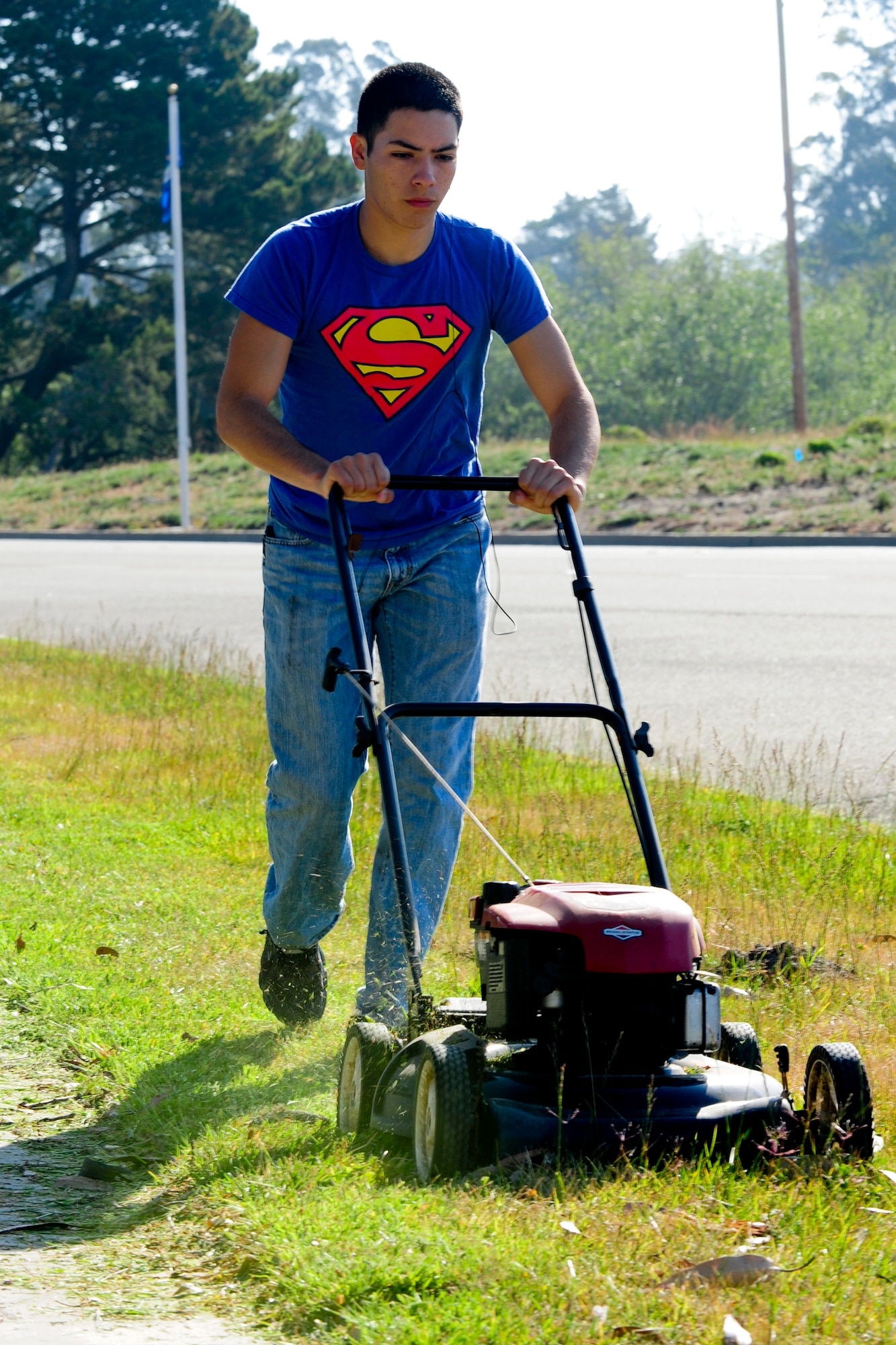 VANDENBERG AIR FORCE BASE, Calif. – Even “Superman”, also known as Airman 1st Class Justin Campos, a 30th Civil Engineer Squadron explosive ordinance disposal apprentice, came out to volunteer during Mission Support Group Pride Day here Friday, May 10, 2013. The MSG Pride Day consisted of more than 80 volunteers with lawnmowers, weed eaters, gloves and trash bags to restore the bases appearance due to budgetary cuts. “The volunteers that have mowed already, and the ones working tomorrow, are restoring the bases appearance that we all expect. After all, our base appearance is a reflection of us as an organization and team,” said Chief Master Sgt. Patrick Abbott, 30th Mission Support Group superintendant. “Its events like this one, and many other ‘spontaneous acts of mowing,’ that show just how much pride we have in our community, Vandenberg AFB and our mission here.” (U.S. Air Force photo/Airman Yvonne Morales)