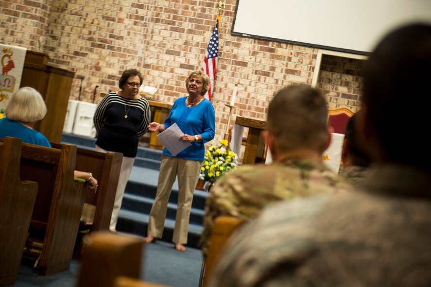 Jane Knight (right) and Zella Fuller, Quilts of Valor Foundation members, speak on the history of Quilts of Valor May 8, 2013, at Moody Air Force Base, Ga. The volunteer organization first made presentations to Moody in 2008. (U.S. Air Force photo by Staff Sgt. Jamal D. Sutter/Released)  
