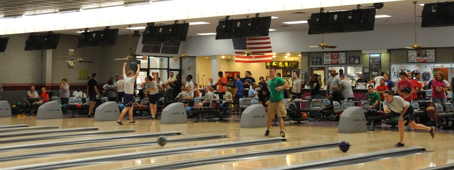 Barksdale Airmen participate in a bowling competition during Sports Day 2013 on Barksdale Air Force Base, La., May 10, 2013. Sports Day consisted of various team events including dodgeball, basketball, soccer, tug-of-war, volleyball, a homerun derby and racquetball. This day was designed to improve team work and help increase the awareness of fitness, sports programs and boost morale. (U.S. Air Force photo/Airman 1st Class Benjamin Gonsier)