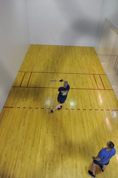 Barksdale Airmen play a game of racquetball during Sports Day 2013 on Barksdale Air Force Base, La., May 10, 2013. Sports Day consisted of various team events including dodgeball, basketball, soccer, tug-of-war, volleyball, a homerun derby and racquetball. This day was designed to improve team work and help increase the awareness of fitness, sports programs and boost morale. (U.S. Air Force photo/Airman 1st Class Benjamin Gonsier)
