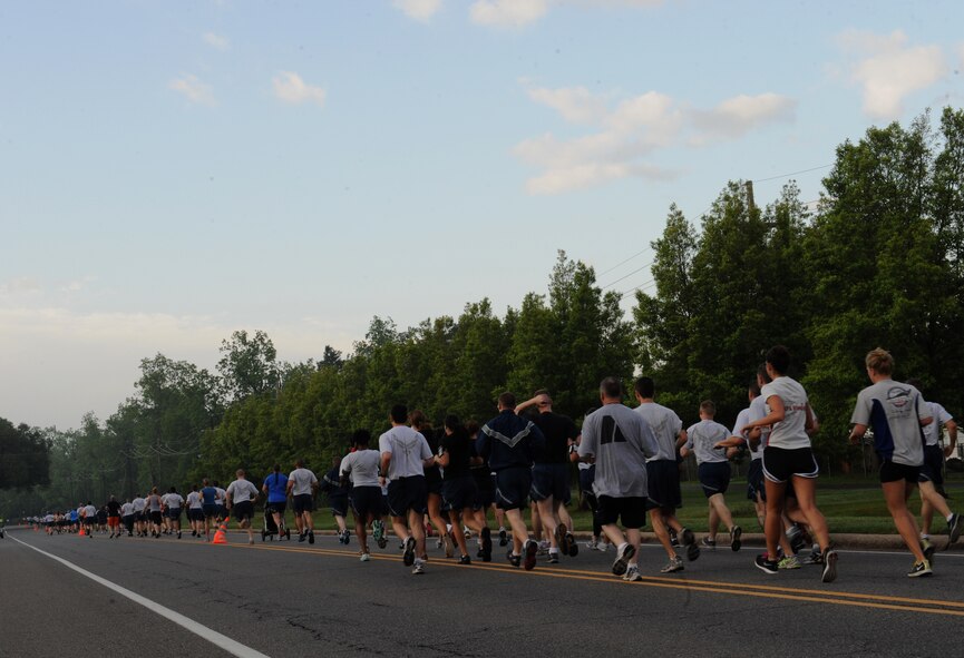 Team Barksdale participates in a 5K Fun Run as part of Sports Day 2013 on Barksdale Air Force Base, La., May 10, 2013. Sports Day consisted of various team events including dodgeball, basketball, soccer, tug-of-war, volleyball, a homerun derby and racquetball. This day was designed to improve team work and help increase the awareness of fitness, sports programs and boost morale. (U.S. Air Force photo/Airman 1st Class Benjamin Gonsier)
