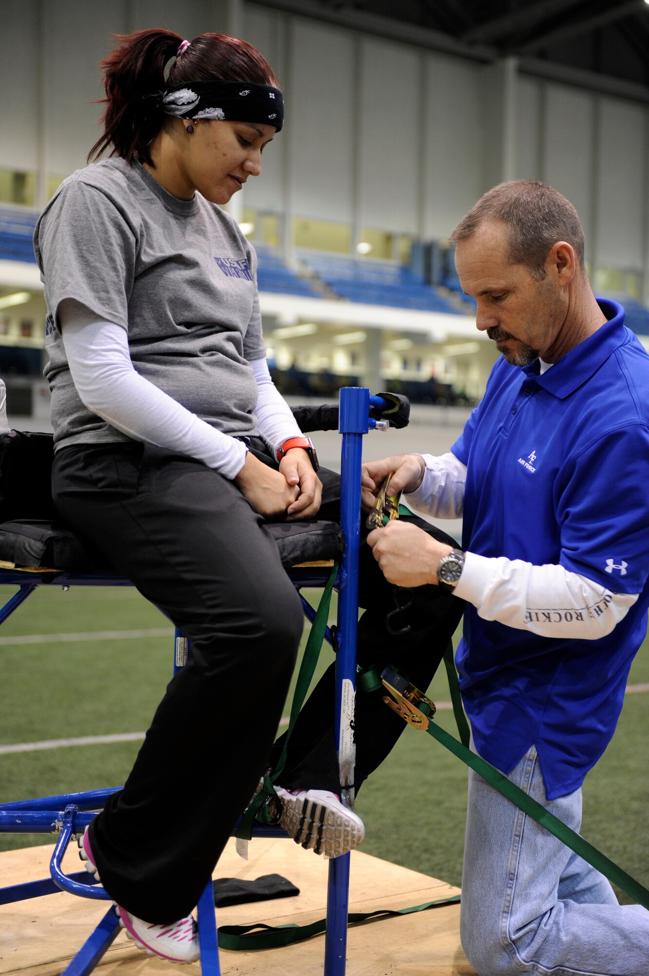 Retired Staff Sgt. Zuleika Cruz-Pereira works with her trainer during training camp for the Warrior Games at Colorado Springs, Colo.  Cruz-Pereira and her 49 Air Force teammates are participating from May 11 through May 16. (DoD photo/Desiree N. Palacios)