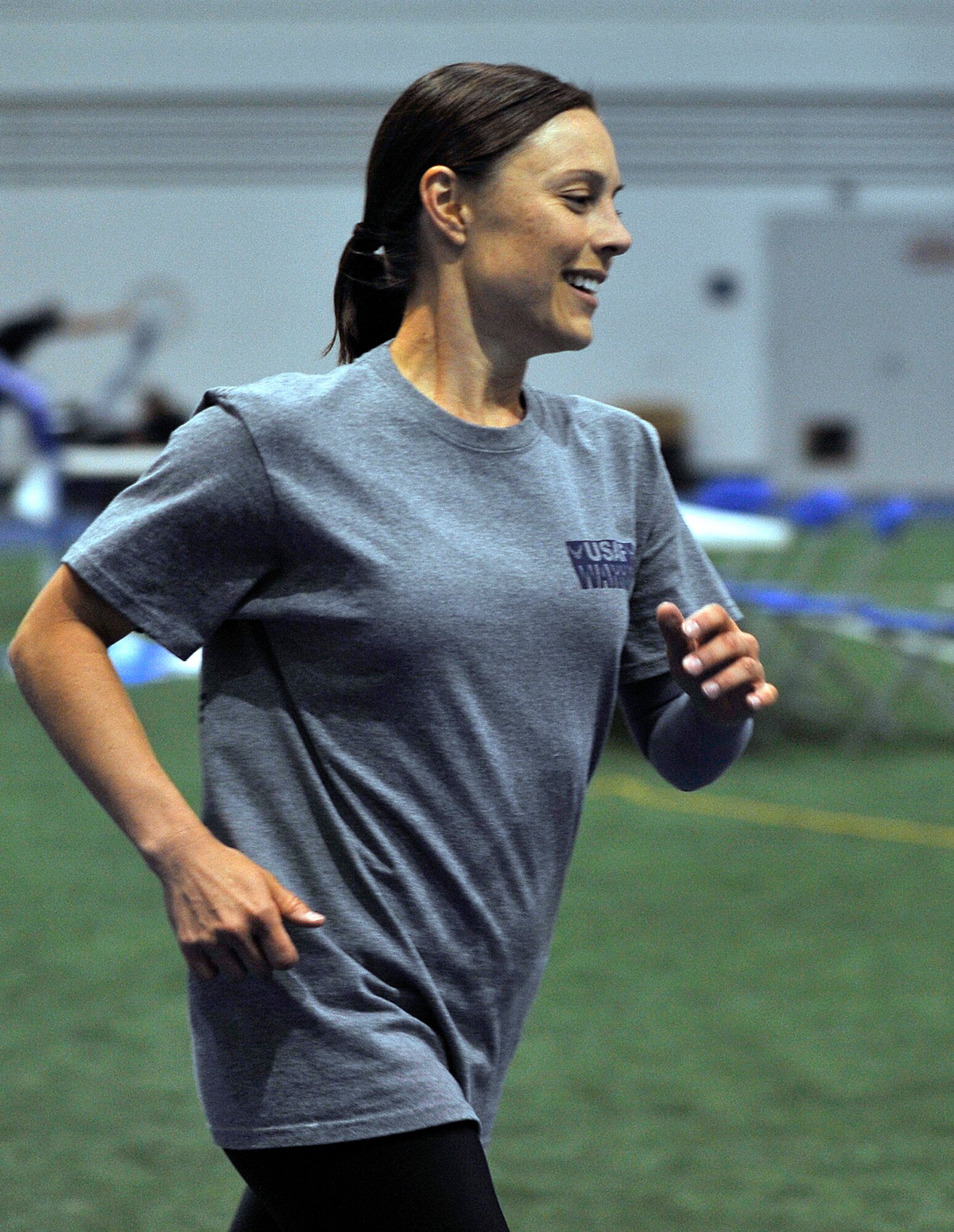 Staff Sgt. Lara Ishikawa runs laps at the Air Force Academy indoor track during the Wounded Warrior Games Training Camp held at the Academy April 18, 2013. Ishikawa is stationed at Joint Base San Antonio-Lackland, Texas. (U.S. Air Force photo/Desiree N. Palacios)