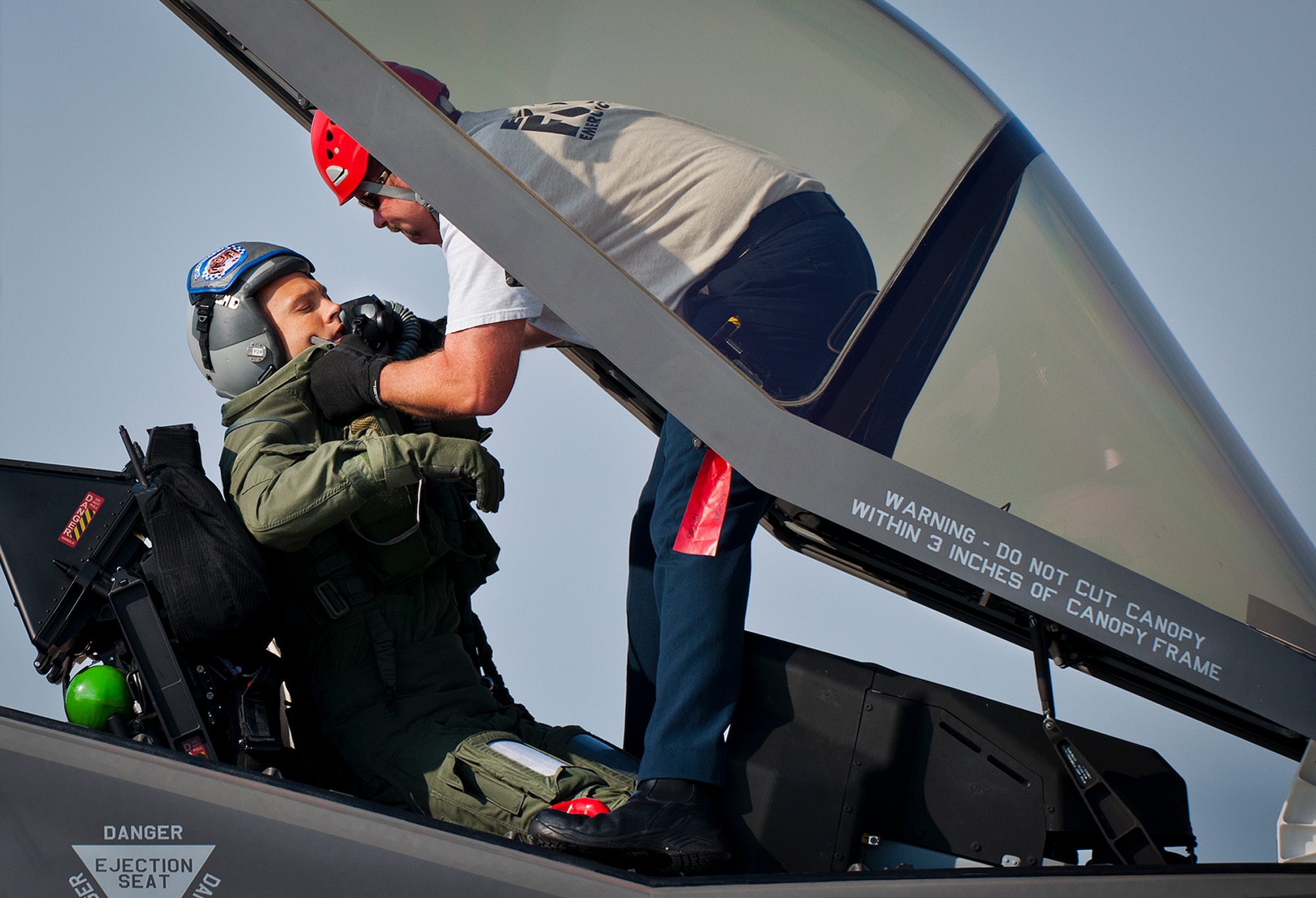 Brian Easterling, a 96th Test Wing firefighter, extracts an injured pilot from an F-35 Lightning II during a major accident response exercise May 9.  This was the first MARE involving the Air Force’s newest fighter aircraft at Eglin.  First responders had to put out fires on debris from the aircraft after a hard landing.  They also had to extract the injured pilot and get him to medical personnel.  (U.S. Air Force photo/Samuel King Jr.)