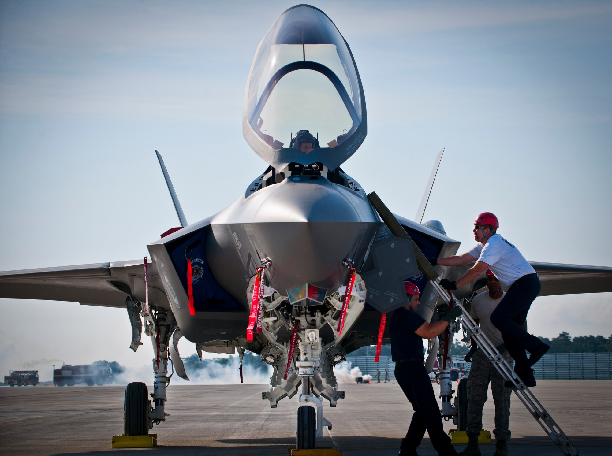 Brian Easterling, a 96th Test Wing firefighter, climbs a ladder to extract an injured F-35 Lightning II pilot during a major accident response exercise May 9.  This was the first MARE involving the Air Force’s newest fighter aircraft at Eglin.  First responders had to put out fires on debris from the aircraft after a hard landing.  They also had to extract the injured pilot and get him to medical personnel.  (U.S. Air Force photo/Samuel King Jr.)