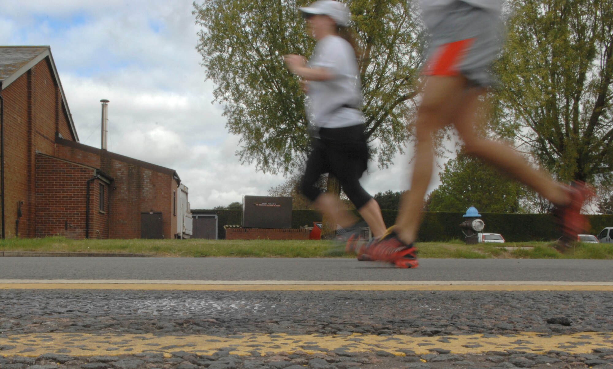 Team Mildenhall participants ran two laps around the base perimeter during a half-marathon May 11, 2013, on RAF Mildenhall, England. Half-marathons cover 13.1 miles.(U.S. Air Force photo by Airman 1st Class Dillon Johnston/Released)