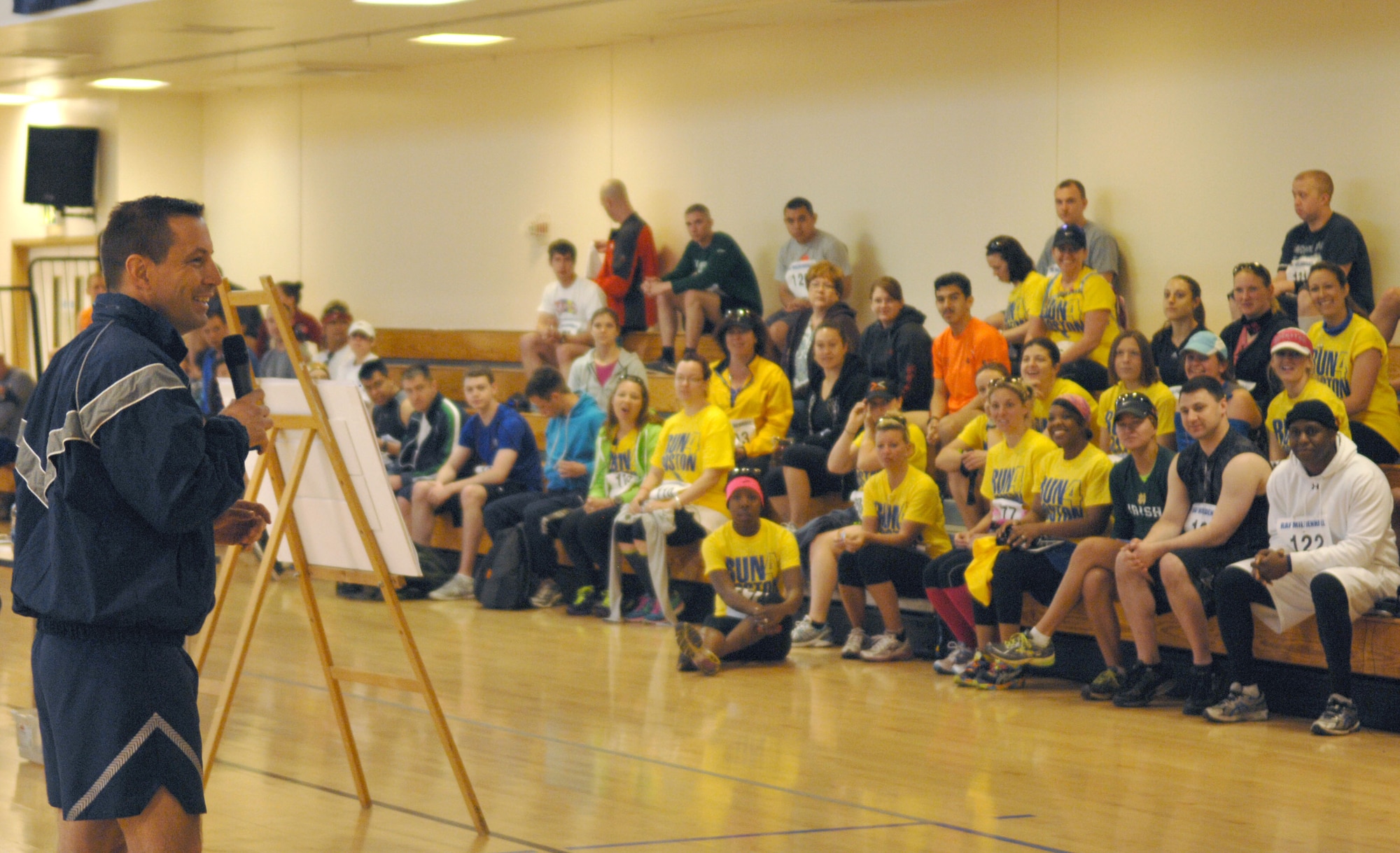 Left, Col. Christopher Kulas, 100th Air Refueling Wing commander, rallies to Airmen before a half-marathon May 11, 2013, at the Hardstand Fitness Center on RAF Mildenhall, England. The half-marathon consisted of two laps around the base perimeter. (U.S. Air Force photo by Airman 1st Class Dillon Johnston/Released)