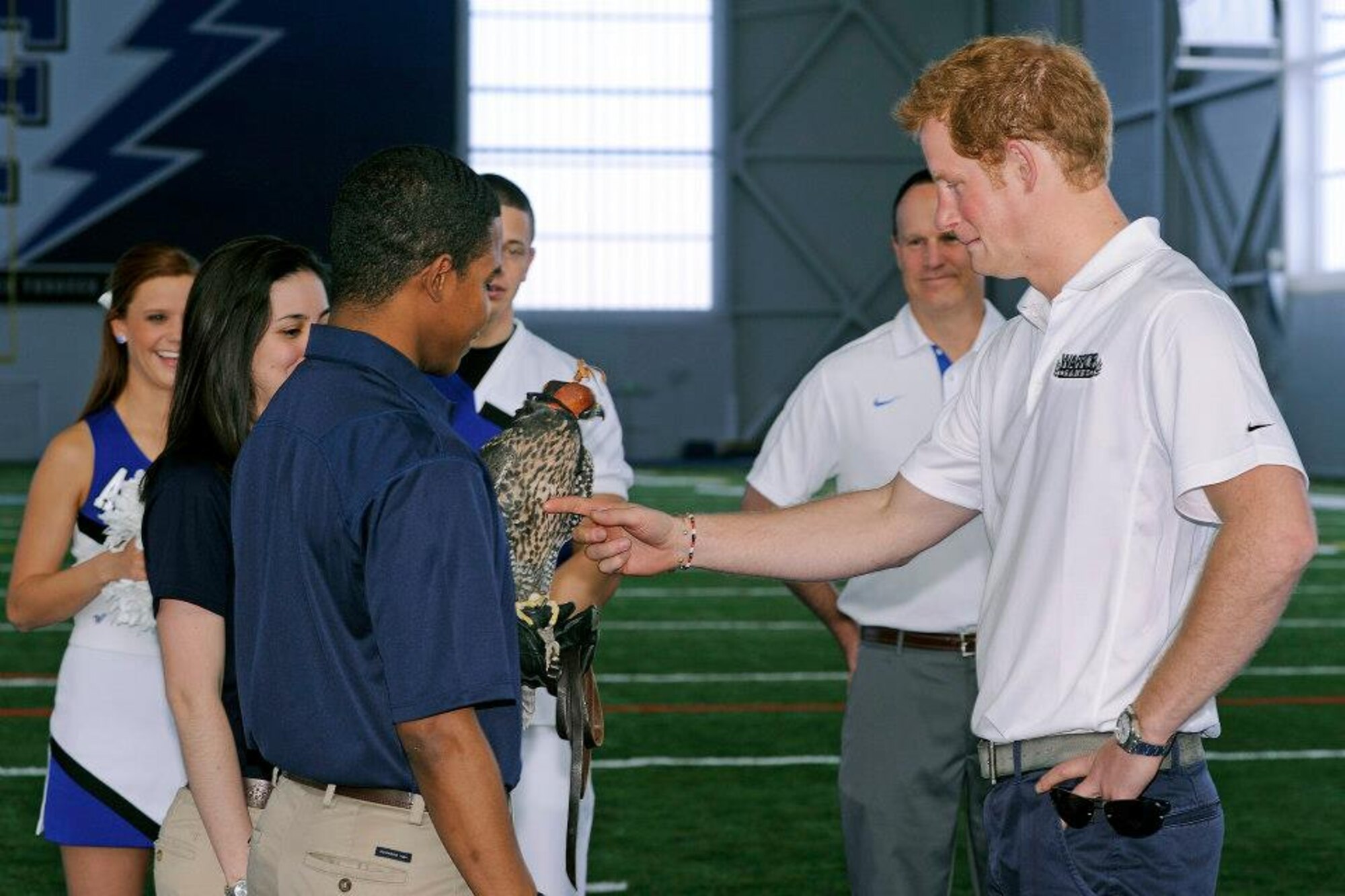 His Royal Highness Prince Henry of Wales meets with cadet falconers during his visit to the Academy May 12. Prince Harry made a stop in Colorado Springs and the Academy during his week-long visit to the United States to raise awareness for Warrior Games, which are taking place here and at the U.S. Olympic Training Center throughout the week. (U.S. Air Force photo/Sarah Chambers)