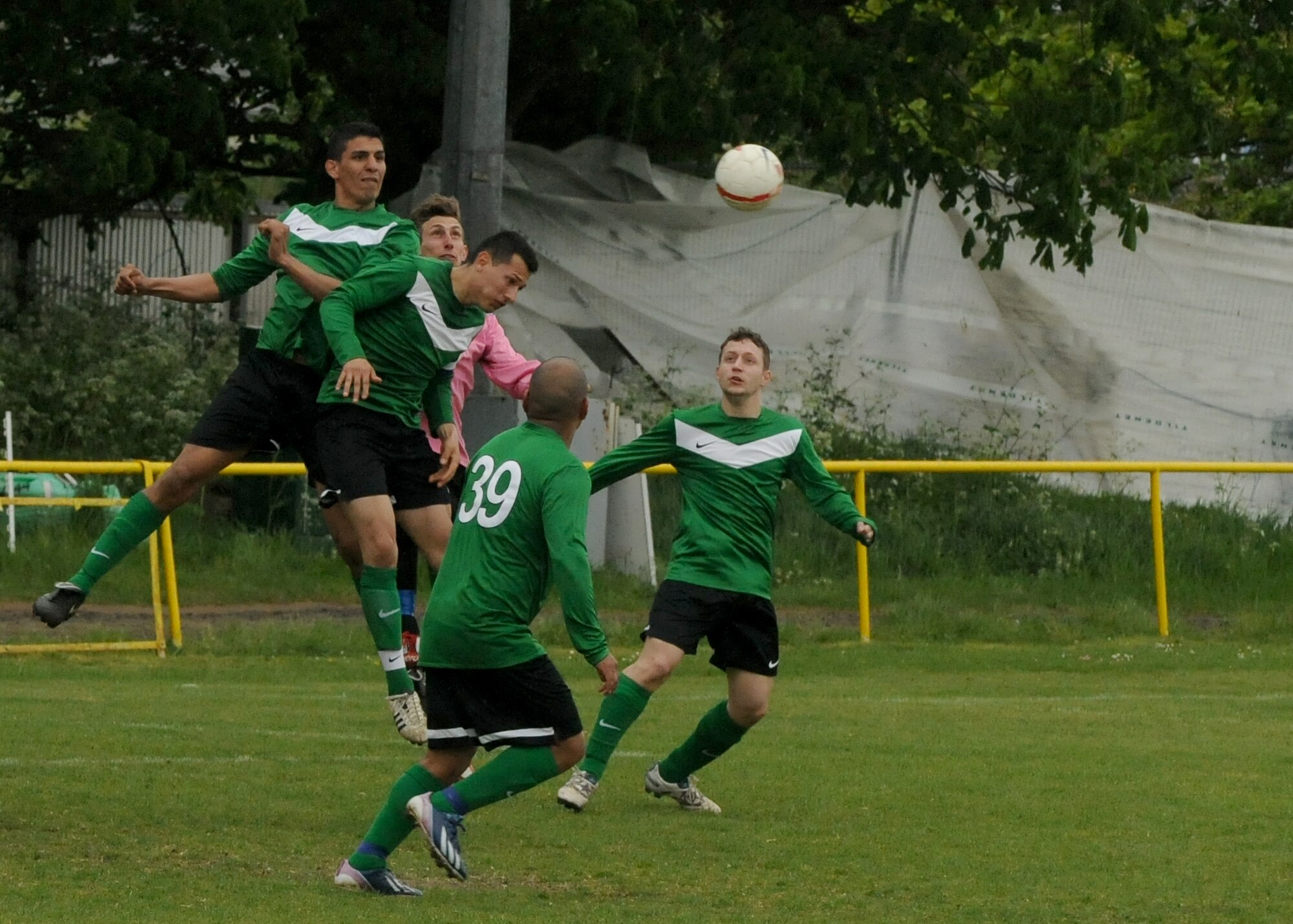 Players scramble for the ball during a match between Liberty Football Club and Racing Newmarket Jocky and Stable Lads Football Team in Newmarket, England, May 12, 2013. Liberty FC is the combined RAF Mildenhall and RAF Lakenheath soccer team. The game was a draw with both teams scoring three goals each. (U.S. Air Force photo by Tech. Sgt. Neal X. Joiner/Released)