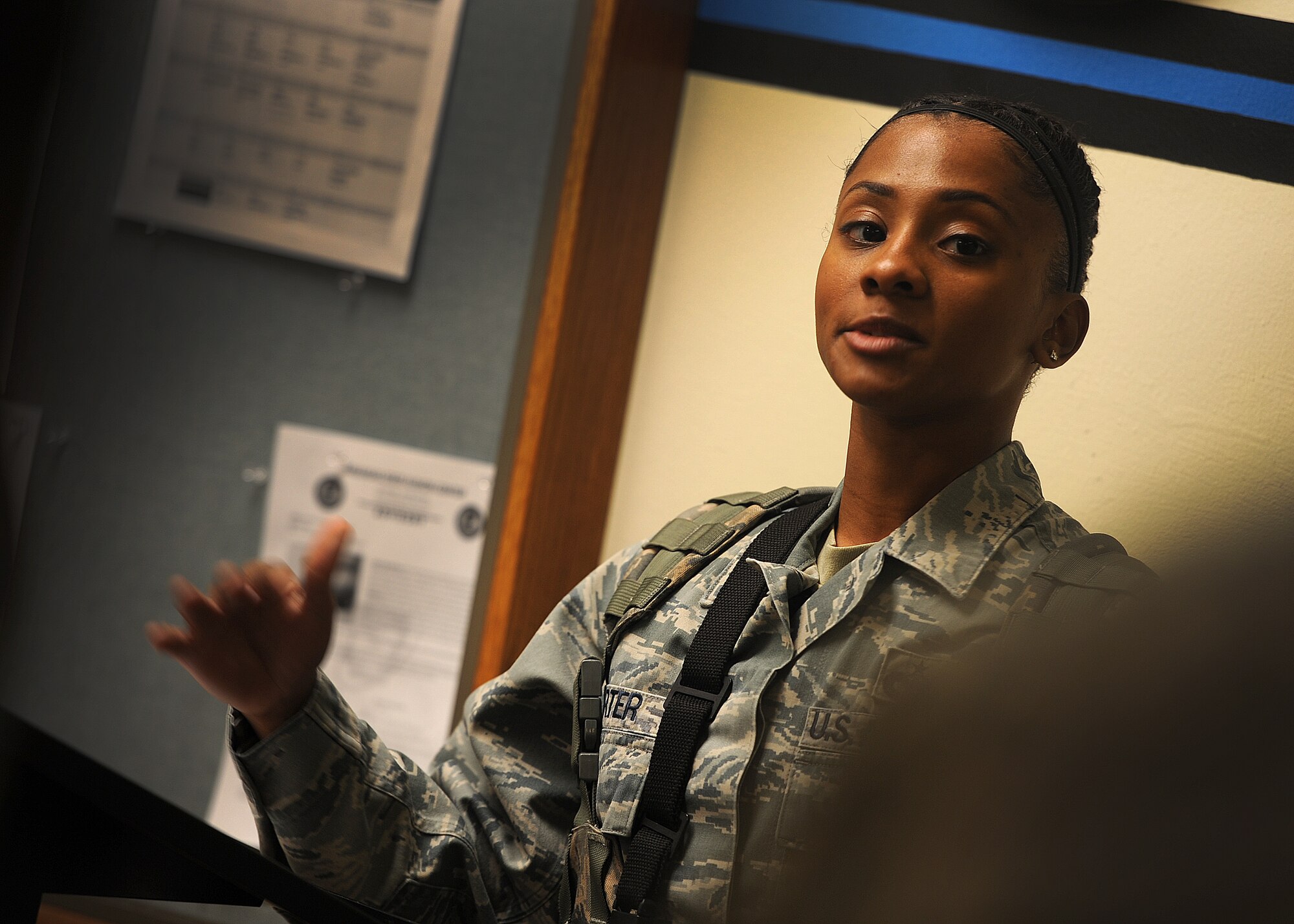 ALTUS AIR FORCE BASE, Okla. – Staff Sgt. Chrystal Carter, 97th Security Forces Squadron flight sergeant, speaks to Airmen during guard mount at the beginning of their shift as a part of the Defender for a Day program at the 97th SFS building, May 11. Guard mount is held at the beginning of every shift to ensure all Airmen know where they are assigned to work and are prepared for the day. The Defender for a Day program was initiated by 97th SFS leadership to recognize defenders for their hard work to the base mission by gathering volunteers from all career fields within the wing to work as defenders for the day. (U.S. Air Force photo by Airman 1st Class Levin Boland / Released)