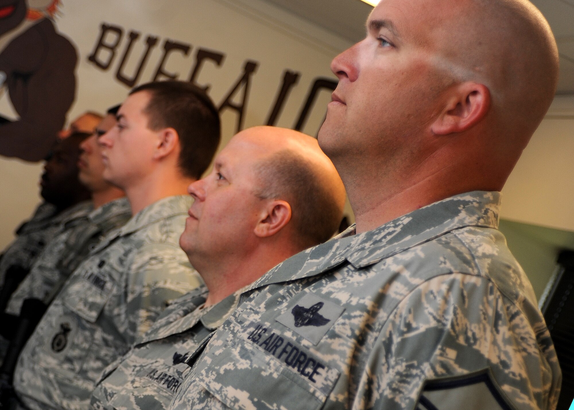 ALTUS AIR FORCE BASE, Okla. – Airmen stand in formation for guard mount at the beginning of their shift as a part of the Defender for a Day program at the 97th Security Forces Squadron building, May 11. Guard Mount is held at the beginning of each shift to ensure all Airmen know where they are assigned to work and are prepared for the day. The Defender for a Day program was initiated by 97th SFS leadership to recognize defenders for their hard work to the base mission by gathering volunteers from all career fields within the wing to work as defenders for the day. (U.S. Air Force photo by Airman 1st Class Levin Boland / Released)