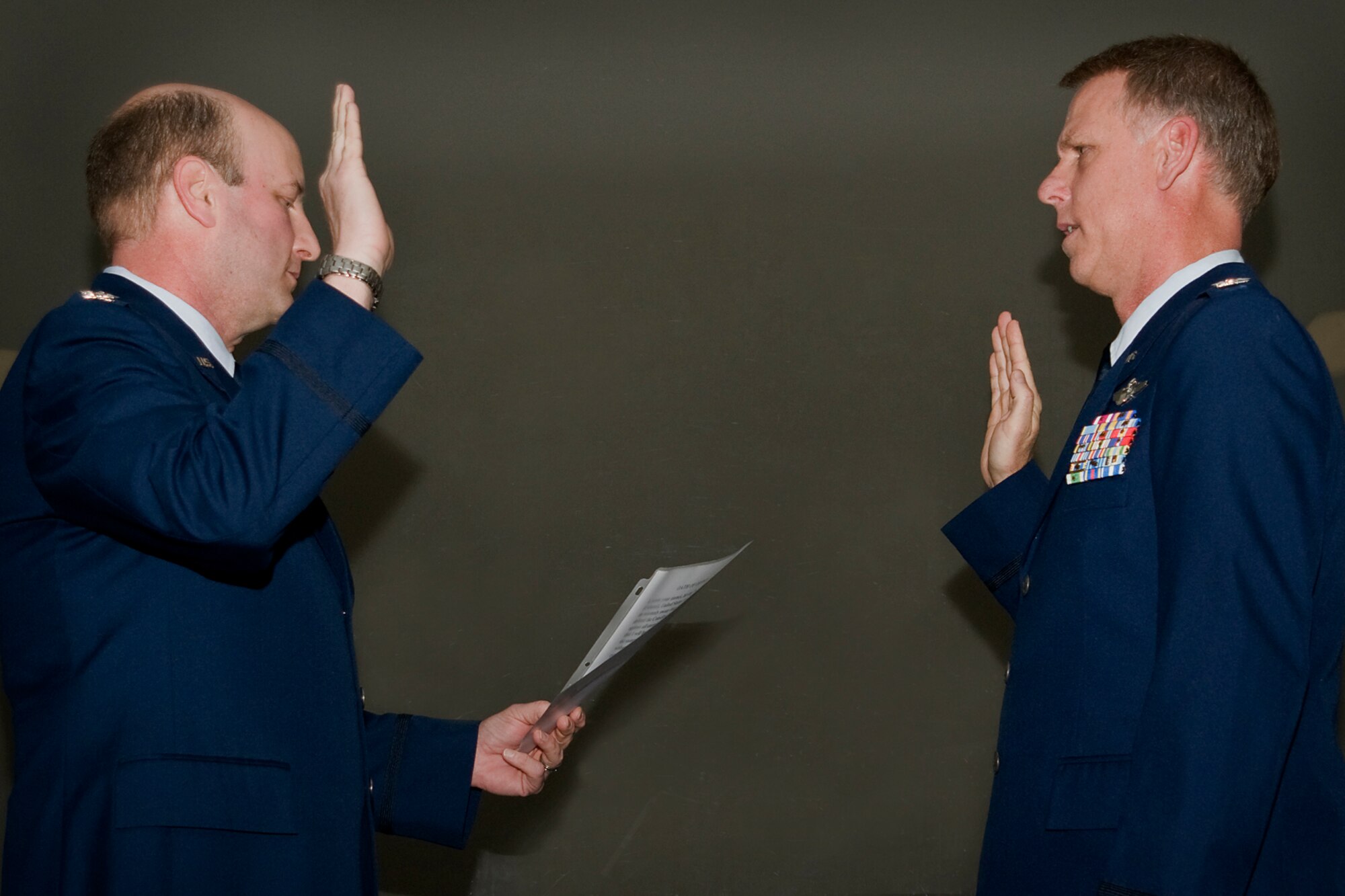 GRISSOM AIR RESERVE BASE, Ind. -- Col. Christopher Amend, 434th Operations Group commander, left, administers an oath of office to Col. Larry H. Shaw III during Shaw's promotion ceremony here May 4. Shaw is currently the 434th Operations Support Squadron commander and will move on to a new position as 927th Operations Group commander at MacDill Air Force Base, Fla. (U.S. Air Force photo/Senior Airman Andrew McLaughlin) 
