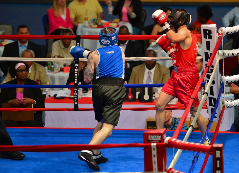 Two boxers compete for their weight class tittle during the Installation Management Command-U.S. Forces Boxing Championship in Wiesbaden, Germany, May 11, 2013. This year's competition was hosted by U.S. Army Garrison Wiesbaden. (U.S. Air Force photo/Airman 1st Class Jordan Castelan)