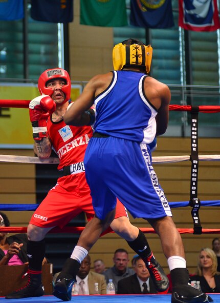 Two boxers compete for their weight class tittle during the Installation Management Command-U.S. Forces Boxing Championship in Wiesbaden, Germany, May 11, 2013. This year's competition was hosted by U.S. Army Garrison Wiesbaden. (U.S. Air Force photo/Airman 1st Class Jordan Castelan)
