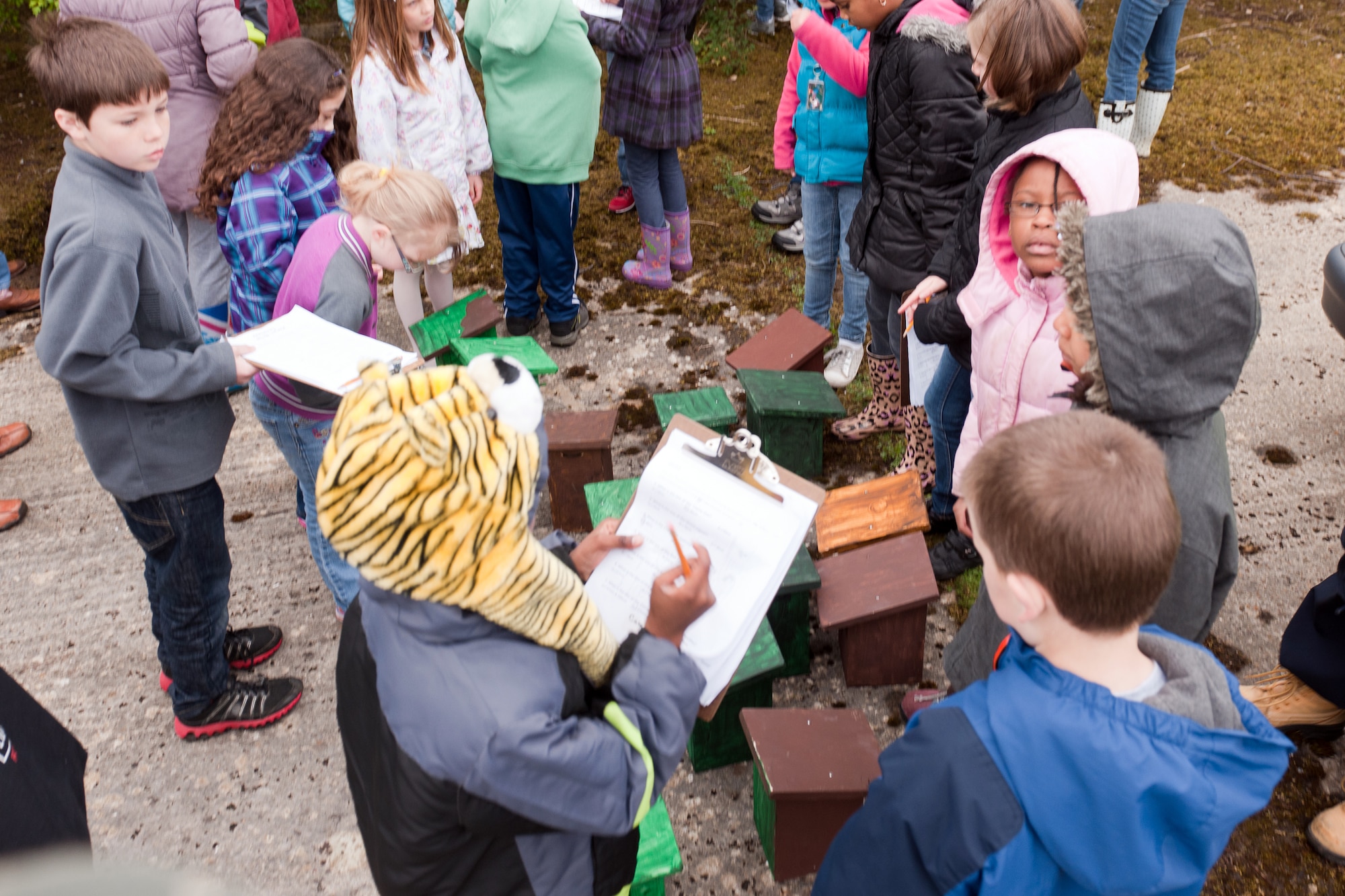 RAF CROUGHTON, United Kingdom – Croughton Elementary School students gather their birdhouses after participating in  treasure hunt at the RAF Croughton Nature Reserve May 10. The students built the birdhouses in honor of Earth Month. The nature reserve is right of RAF Croughton and is managed by the 422nd Air Base Group environmental department. To access the reserve, call the environmental department at 236-8456. (U.S. Air Force photo by Staff Sgt. Brian Stives)