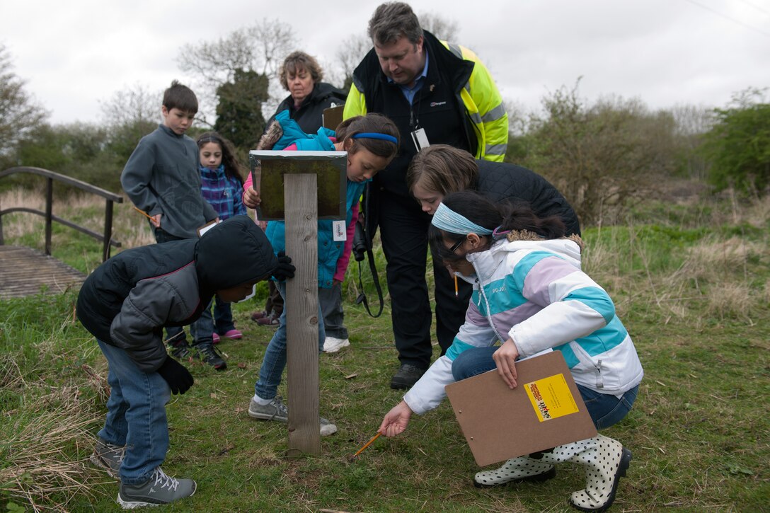 RAF CROUGHTON, United Kingdom – Croughton Elementary School students watch a slug crawl across the ground during a treasure hunt at the RAF Croughton Nature Reserve May 10. The nature reserve is right of RAF Croughton and is managed by the 422nd Air Base Group environmental department. To access the reserve, call the environmental department at 236-8456. (U.S. Air Force photo by Staff Sgt. Brian Stives)