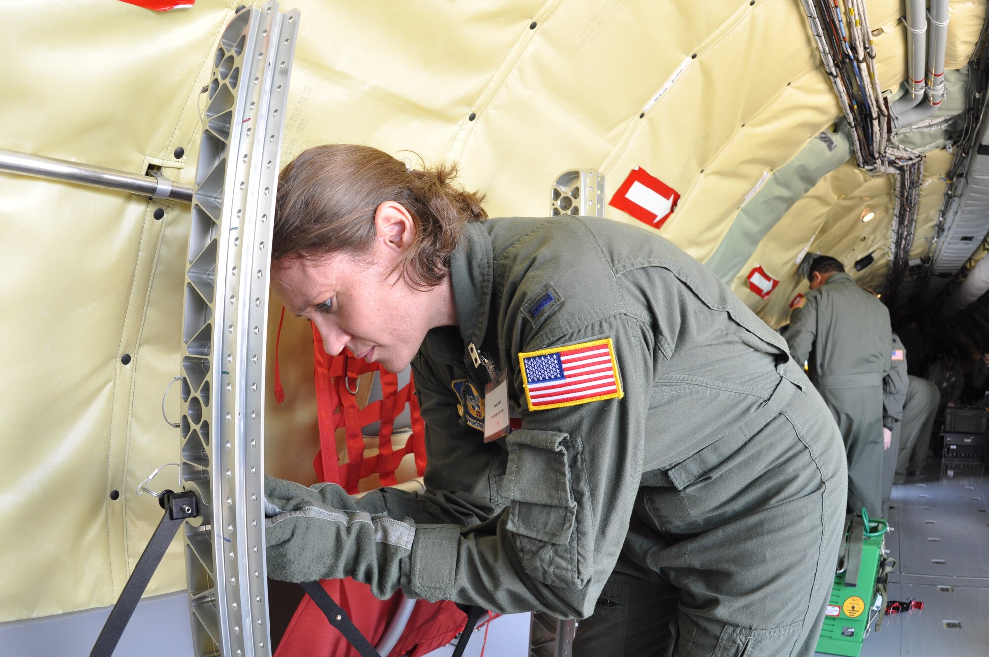 1st Lt. Brandie Bedore, a flight nurse with the 433rd Aeromedical Evacuation Squadron assembles a stanchion litter system during an aeromedical evacuation training aboard a KC-135, May 11.