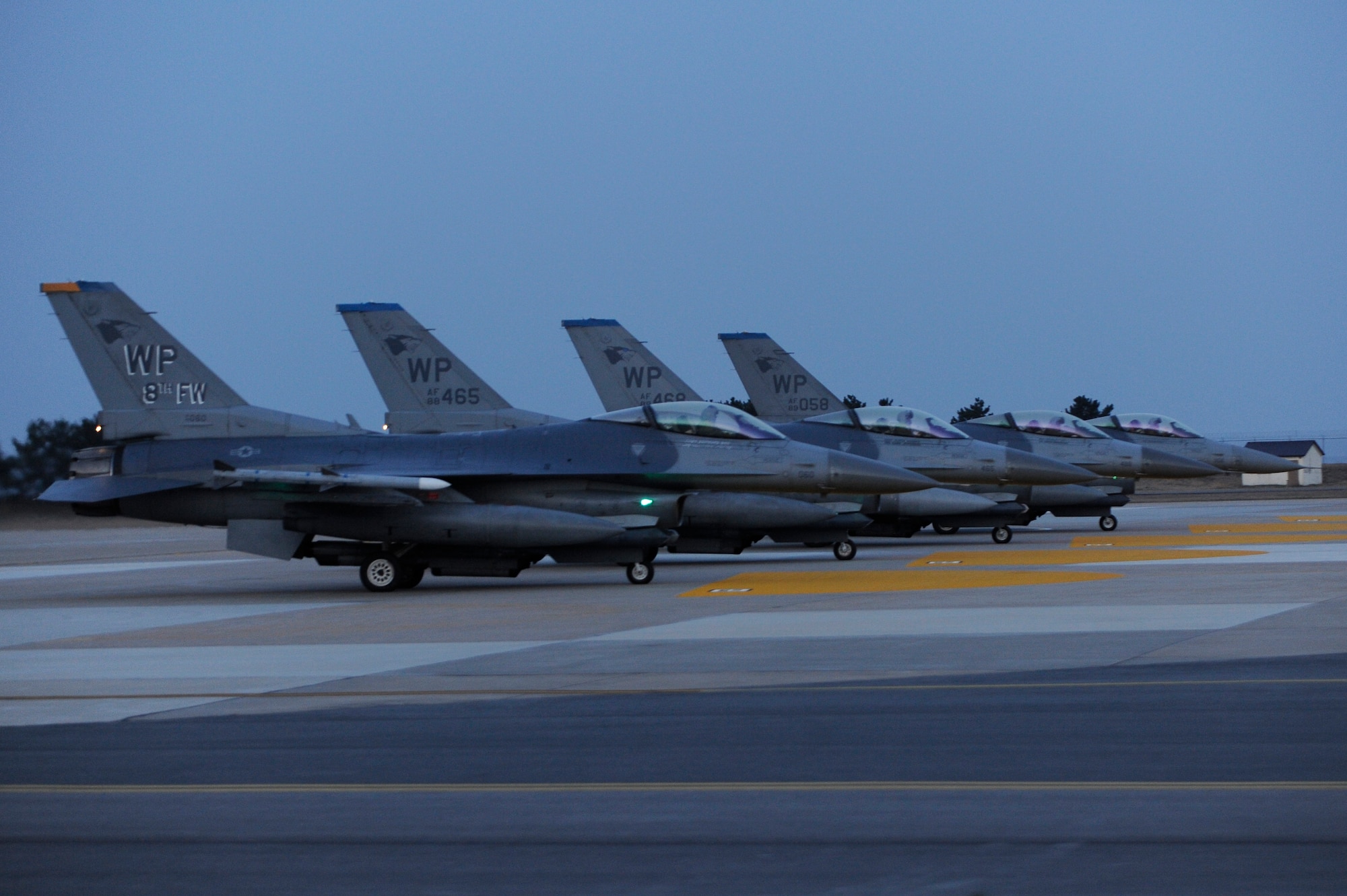 KUNSAN AIR BASE, Republic of Korea -- F-16 Fighting Falcons with the 8th Fighter Wing line up on the runway during exercise Beverly Bearcat 13-01 at Kunsan Air Base, Republic of Korea, April 9, 2013, as part of the wing’s annual inspection. The pilots waited for the control tower to clear them for takeoff before proceeding down the runway. (U.S. Air Force photo by Senior Airman Marcus Morris/Released)