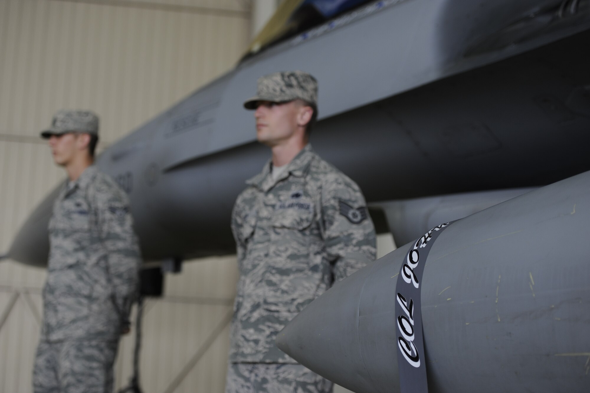 KUNSAN AIR BASE, Republic of Korea -- Outgoing 8th Fighter Wing commander, Col. John Pearse’s name tape hangs from an F-16 Fighting Falcon during a change of command ceremony at Kunsan Air Base, Republic of Korea, May 10, 2013. Staff Sgt. Nicholas Filer and Senior Airman Grant Gibbons, 8th Aircraft Maintenance Squadron crew chiefs, removed Pearse’s name from the 8th Fighter Wing commander’s aircraft, to reveal Col. S. Clinton Hinote’s, who assumed command. (U.S. Air Force photo by Staff Sgt. Tong Duong/ Released)  