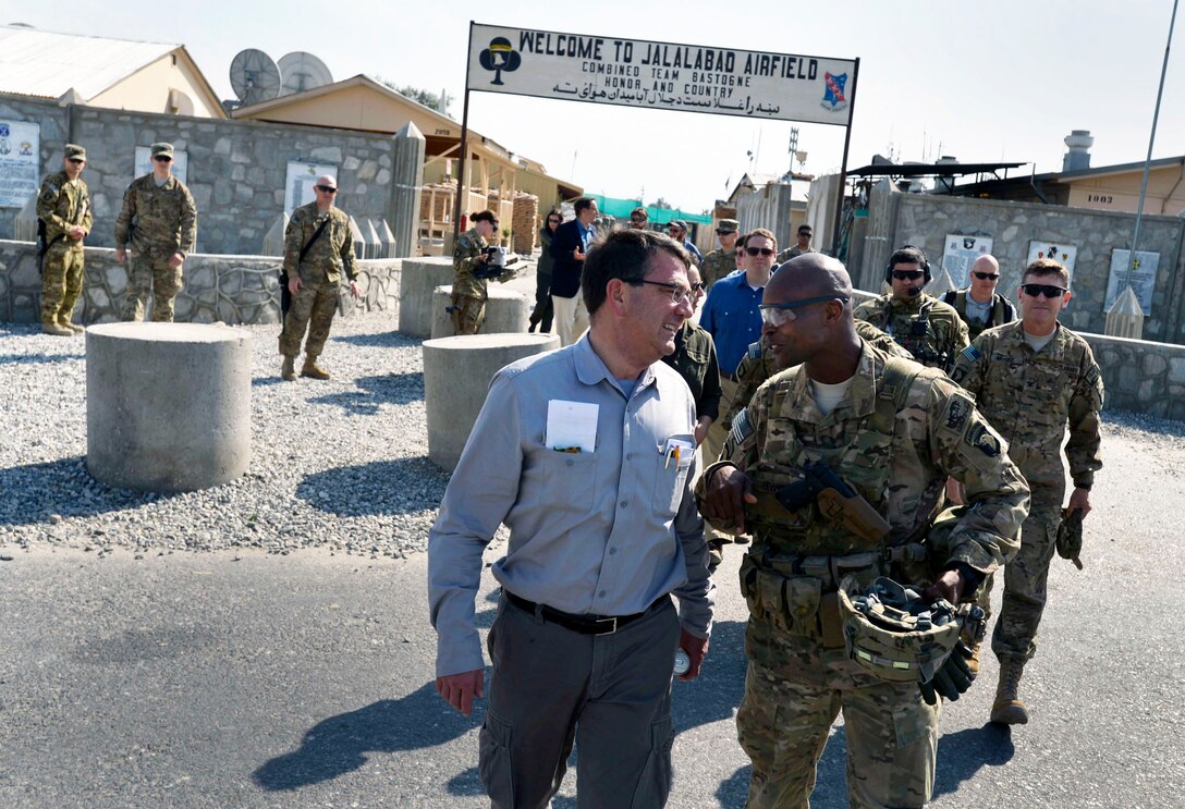 U.S. Army Brig. Gen. Ronald F. Lewis escorts U.S. Deputy Defense Secretary Ash Carter to an awaiting helicopter as he wraps up a visit to Jalalabad Air Base, Afghanistan, May 13, 2013. Lewis is the deputy commanding general for support for Regional Command East.