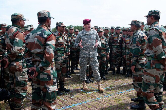 U.S. Army Maj. Gen. John W. Nicholson, center, commanding general of the 82nd Airborne Division, welcomes Indian army troops assigned to the 99th Mountain Brigade, the 50th Independent Para Brigade, and supporting elements to Yudh Abhyas 2013 on Fort Bragg, N.C., May 3, 2013.