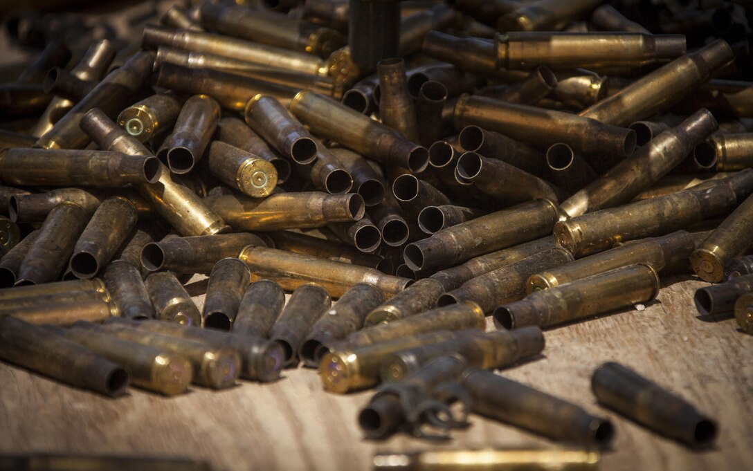 Expended shell casing from an M240B machine gun belonging to Headquarters Company, Regimental Combat Team 7, lay on the during familiarization shoot on Camp Leatherneck, Helmand province, Afghanistan, May 12, 2013. The range was conducted to familiarize the shooters on the proper employment of the respective weapons systems. (U.S. Marine Corps photo by Staff Sgt. Ezekiel R. Kitandwe/Released)