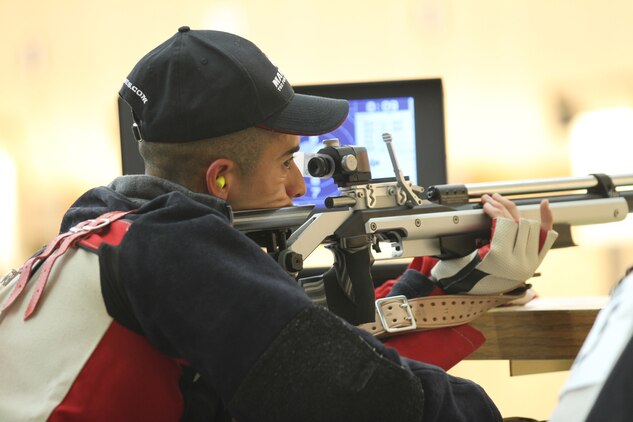 Sgt. Jorge Toledo, 30, from Miami, Fla., and currently assigned to Wounded Warrior Battalion West, fires his air rifle during the permanent disability shooting competition at the 2013 Warrior Games at the U.S. Olympic Training Center in Colorado Springs, Colo., May 13.