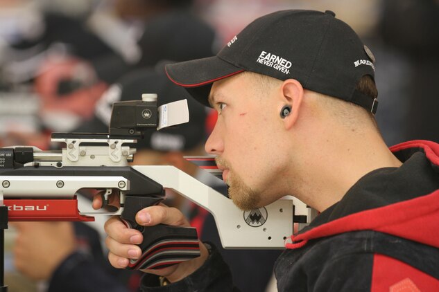 Marine veteran Lance Cpl. Richard Stalder sights in during the air rifle competition finals at the 2013 Warrior Games aboard the U.S. Olympic Training Center in Colorado Springs, Colo. Stalder, 22, from Muenster, Texas, won a gold medal in his respective shooting competition.