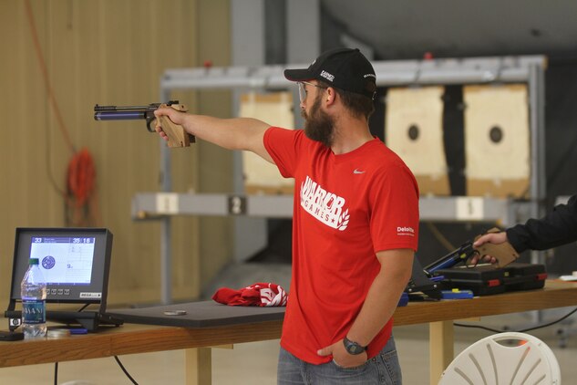 Marine veteran Capt. Richard Rush, from Umpqua, Ore., fires his air pistol during the open standing pistol portion of the shooting event at the 2013 Warrior Games at the U.S. Olympic Training Center in Colorado Springs, Colo.