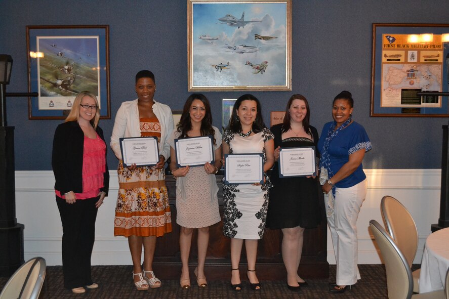 The Shaw Air Force Base Enlisted Spouses’ Club hosted a reception at the Carolina Skies Club and Conference Center to recognize the winners of its 2013 scholarships, Shaw AFB, S.C., May 9, 2013. The ESC awarded $4,000 in scholarships to five enlisted spouses who are pursuing their first degree or are continuing their education in pursuit of a higher degree. Pictured are Ashley Klodt, ESC president; scholarship winners: Genine Blue, Jazmine Wilkes, Soyla Rice, and Jenna Marks; and Master Sgt. Thalia Wilkerson, ESC advisor. Not pictured is Tech. Sgt. Darius Harper, the fifth scholarship winner. (Courtesy photo by Amy Kearnes/Released)