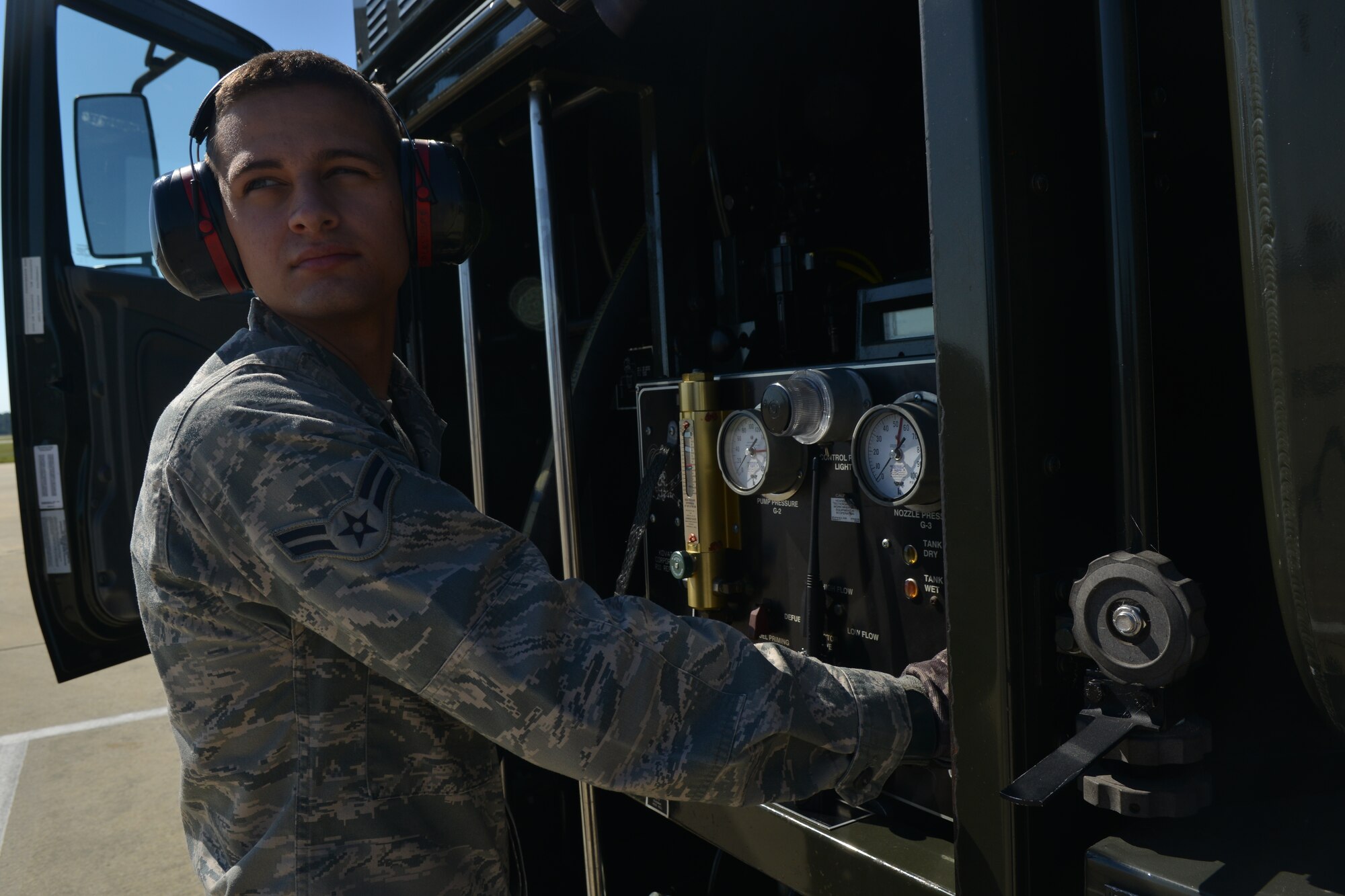 U.S. Air Force Airman 1st Class Jason Gill, Logistic Readiness Squadron fuel operator, helps with the fueling process for hot pits, Shaw Air Force Base, S.C., May 9, 2013. The hot pits refueling process is practiced in order to prepare for fast-tempo refueling and to make sure pilots are able to take flight as soon as possible. (U.S. Air Force photo by Airman 1st Class Ashley L. Gardner/Released)