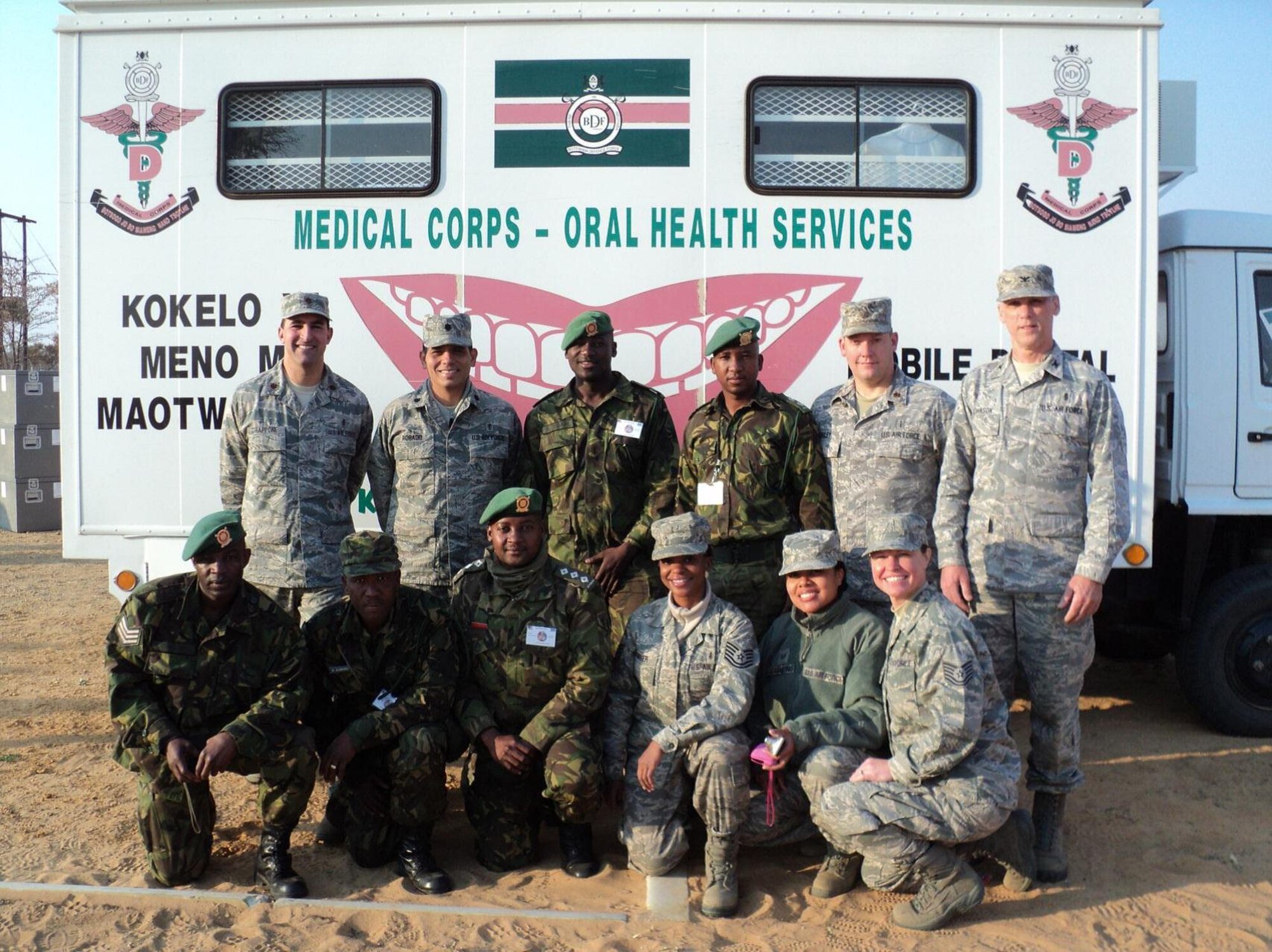 Maj. Vincent Chiappone (upper left) participates with a multinational dental team during Exercise SOUTHERN/MED ACCORD, in the vicinity of Thebephatshwa Air Base, Botswana in August 2012.The five-phase deployment included peacekeeping operations and humanitarian civic action assistance operations. (Courtesy photo)
