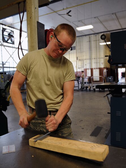 Airman 1st Class John Nellist, 2nd Maintenance Squadron Fabrication Flight sheet metal, creates a door hinge on Barksdale Air Force Base, La., May 14, 2013. Sheet metal Airmen create metal parts for aircraft and other equipment when parts need to be replaced. (U.S. Air Force photo/Airman 1st Class Benjamin Gonsier)
