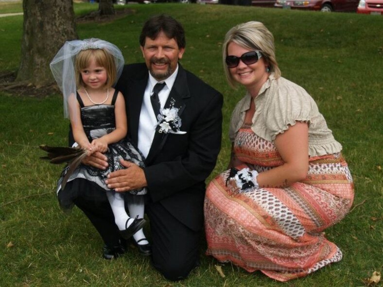 (Retired) Sgt. Jolene Raciborski, her father Joseph and her daughter Abbigail, pose for a photo at Joseph’s wedding. Abbigail was the flower girl for the event. (Courtesy Photo)