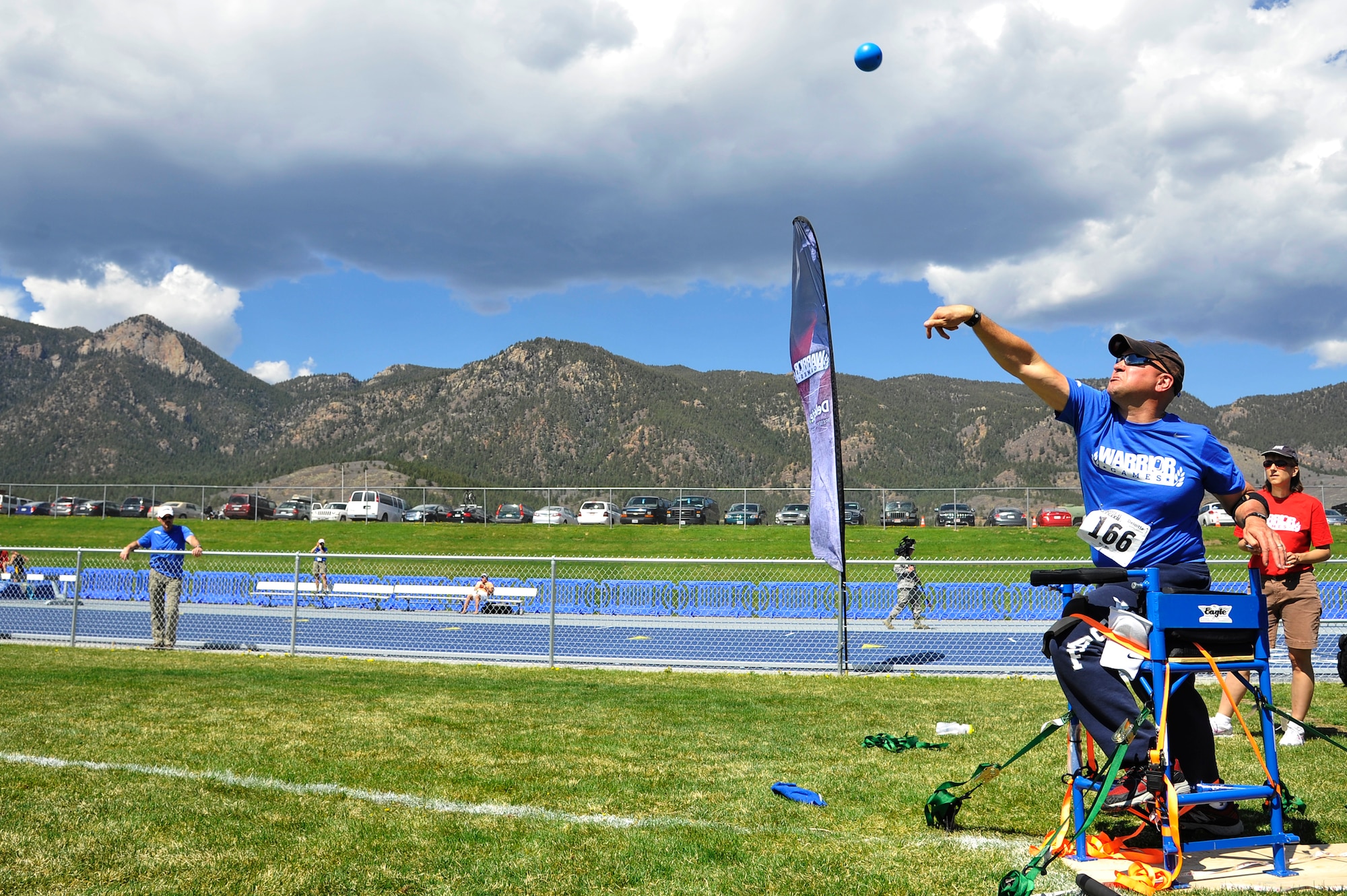 Retired Chief Master Sgt. Damian Orslene hurls a shot-put during the 2013 Warrior Games at the U.S. Air Force Academy May 14, Colorado Springs, Colo. The Warrior Games enable service members and veterans who are injured or ill to compete in a variety of Paralympic sports. (U.S. Air Force photo by Staff Sgt. Christopher Boitz/Released)